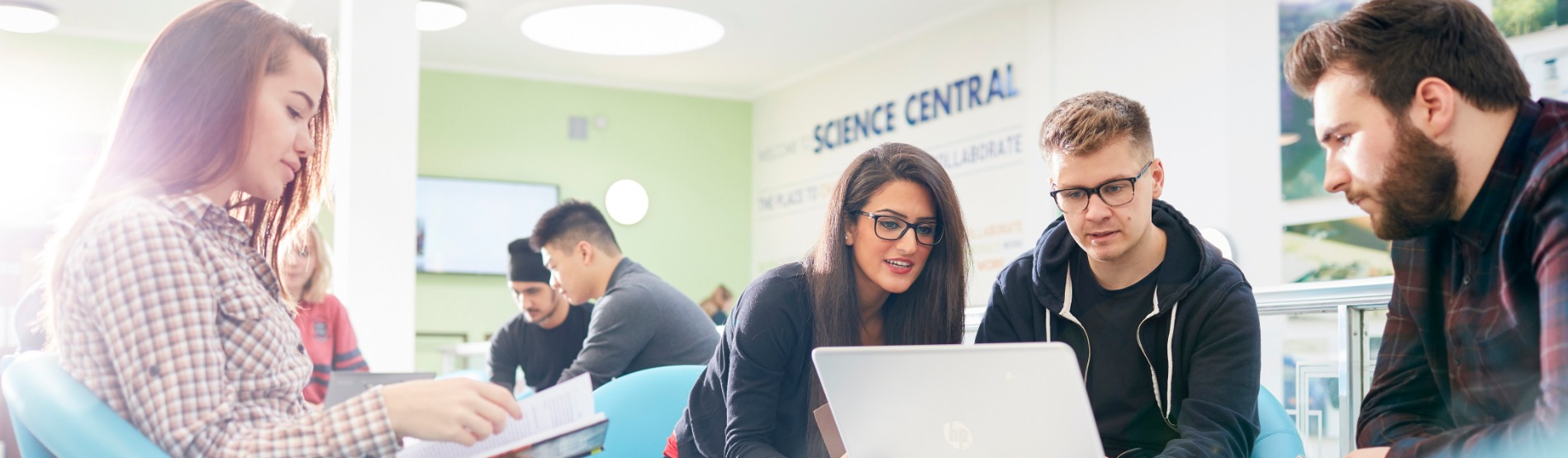 Students sat in creative space with laptops