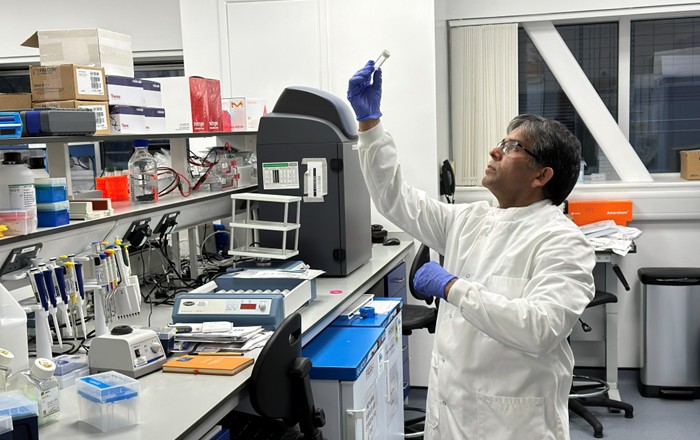 Dr Minshad Ansari, Founder and CEO of Bionema Group, working in a lab. Credit: Bionema Group.